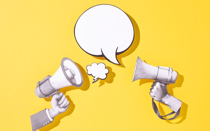 top-view-megaphones-speech-bubble